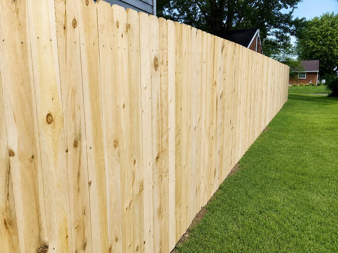 A treated pine privacy fence built by Armor Fence